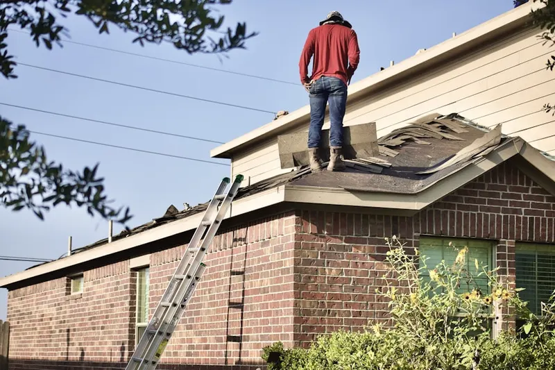 Professional roofer working on a residential roof in Unionville